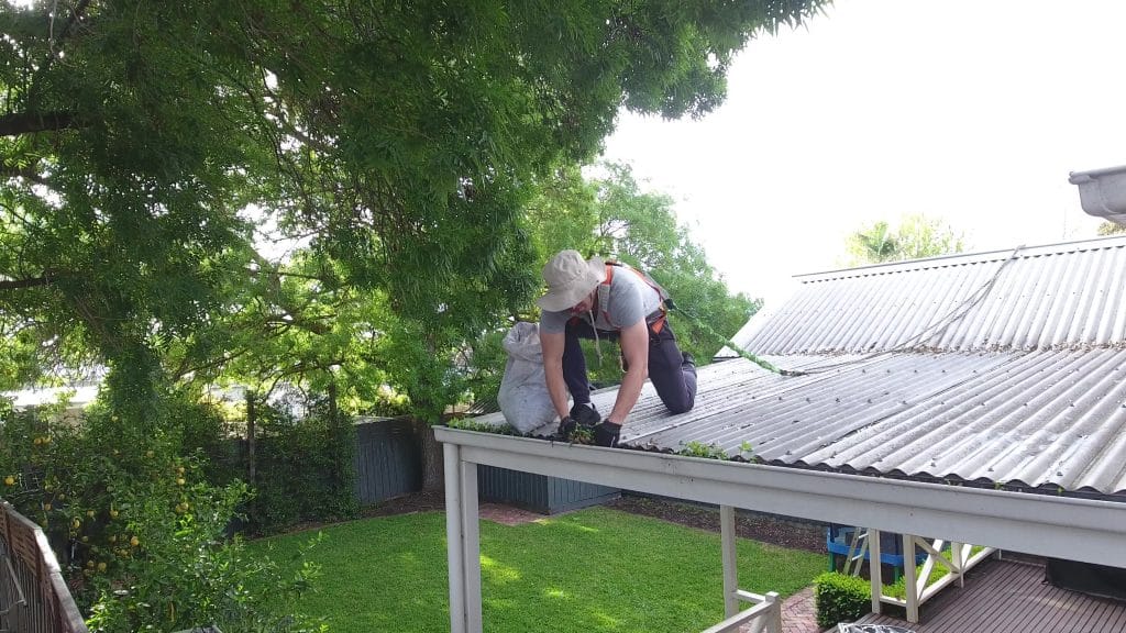 Cleaning gutters by hand